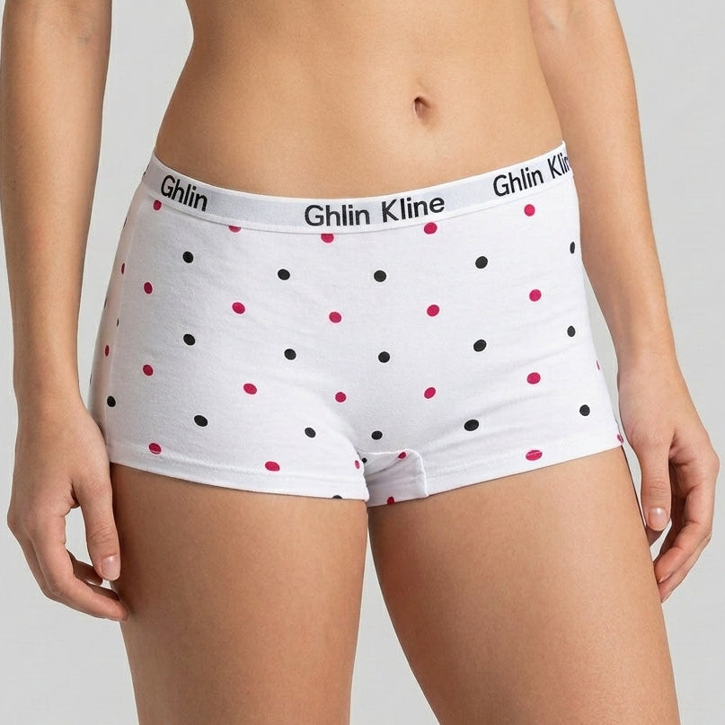 White high-waisted boxer briefs with black and pink polka dots, featuring the Ghlin Kline brand name on the waistband, shown on a model.