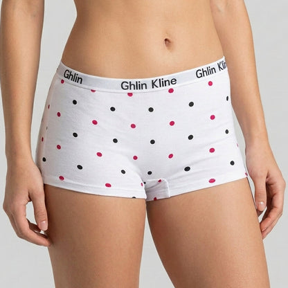 White high-waisted boxer briefs with black and pink polka dots, featuring the Ghlin Kline brand name on the waistband, shown on a model.