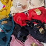 Collection of Inner Bazar lace and satin bras in various colors including red, black, teal, and pink.